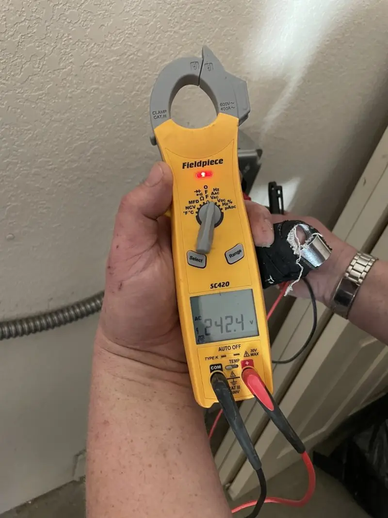Voltage testing with clamp meter during Ceiling Fan Installation in San Marcos
